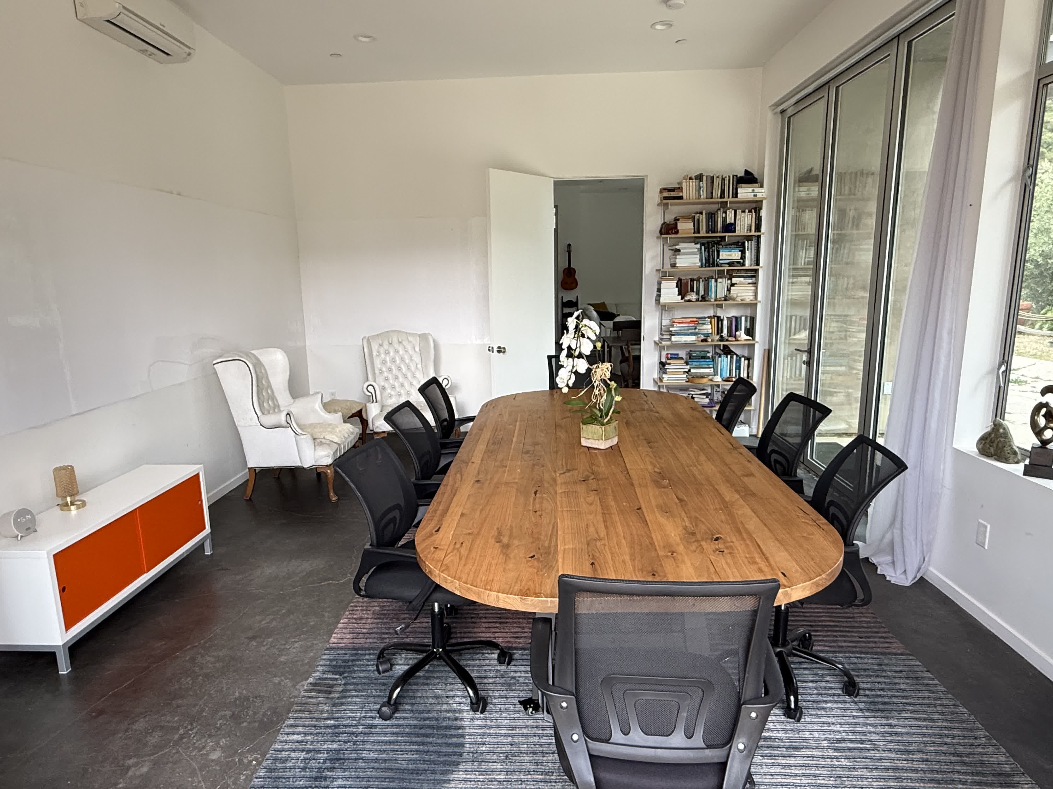 Smaller meeting room inside the Topanga house set up for team work.