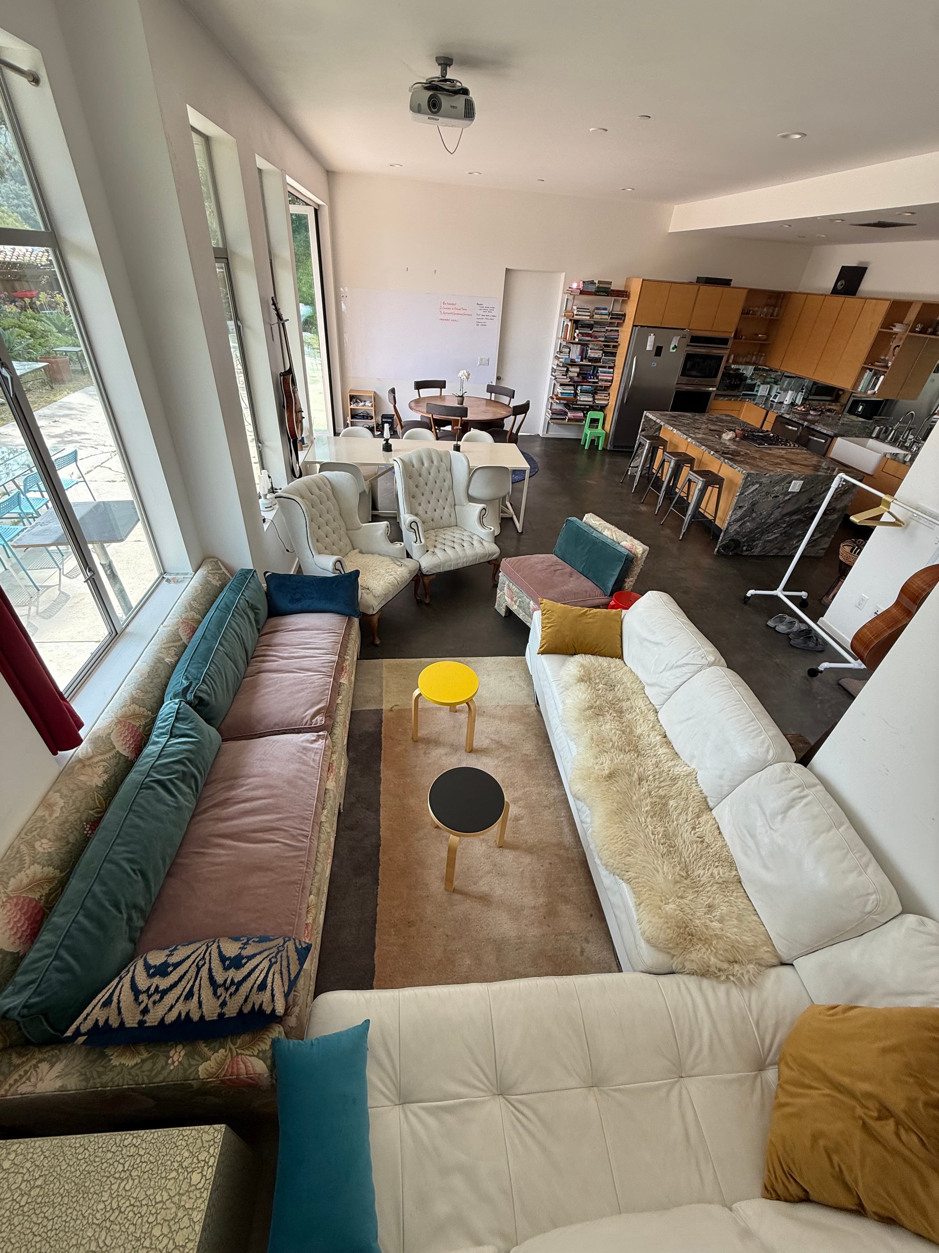Sofa zone connected to the cowork and kitchen area.