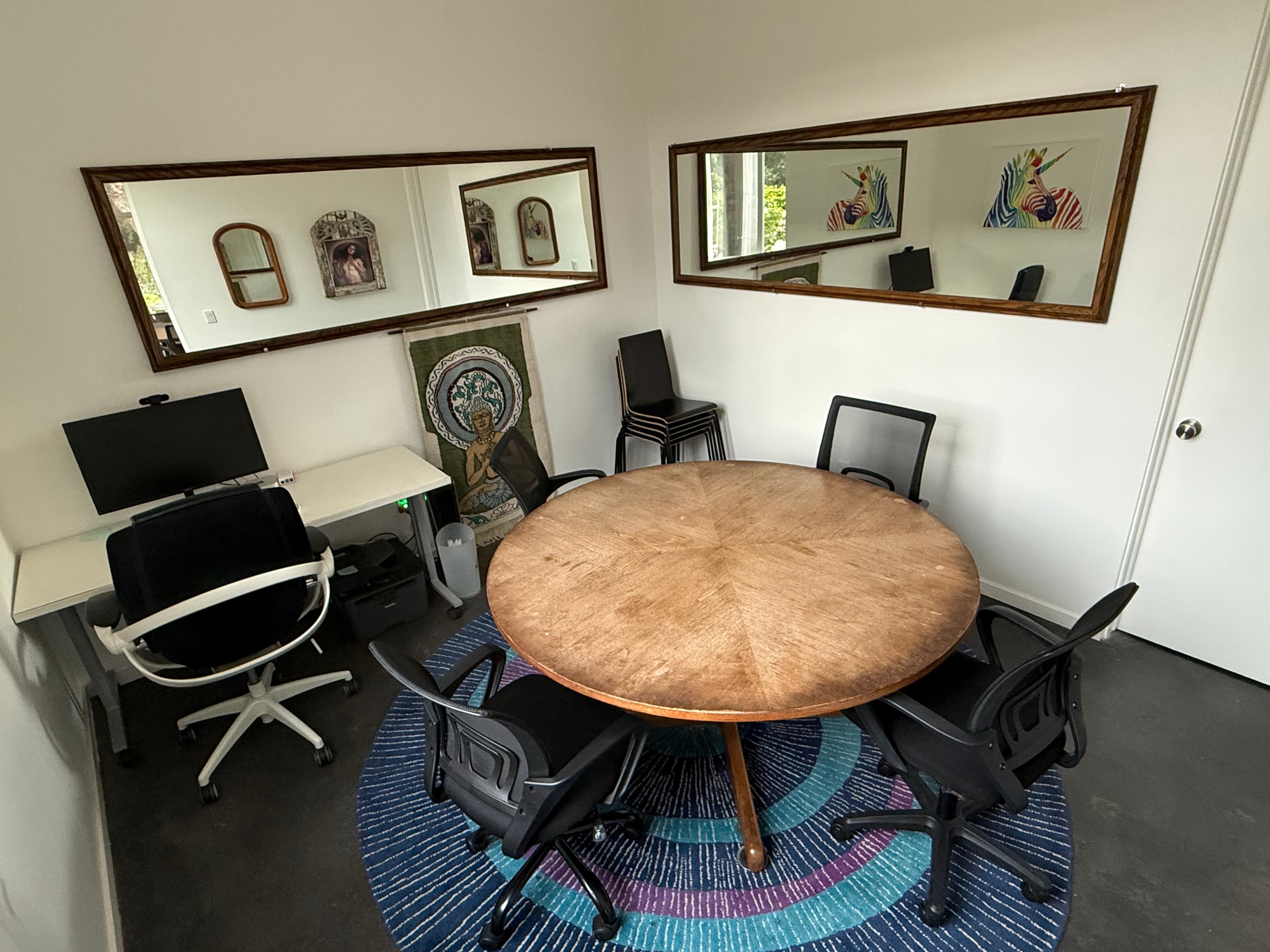 Circle room with mirrors during the day.