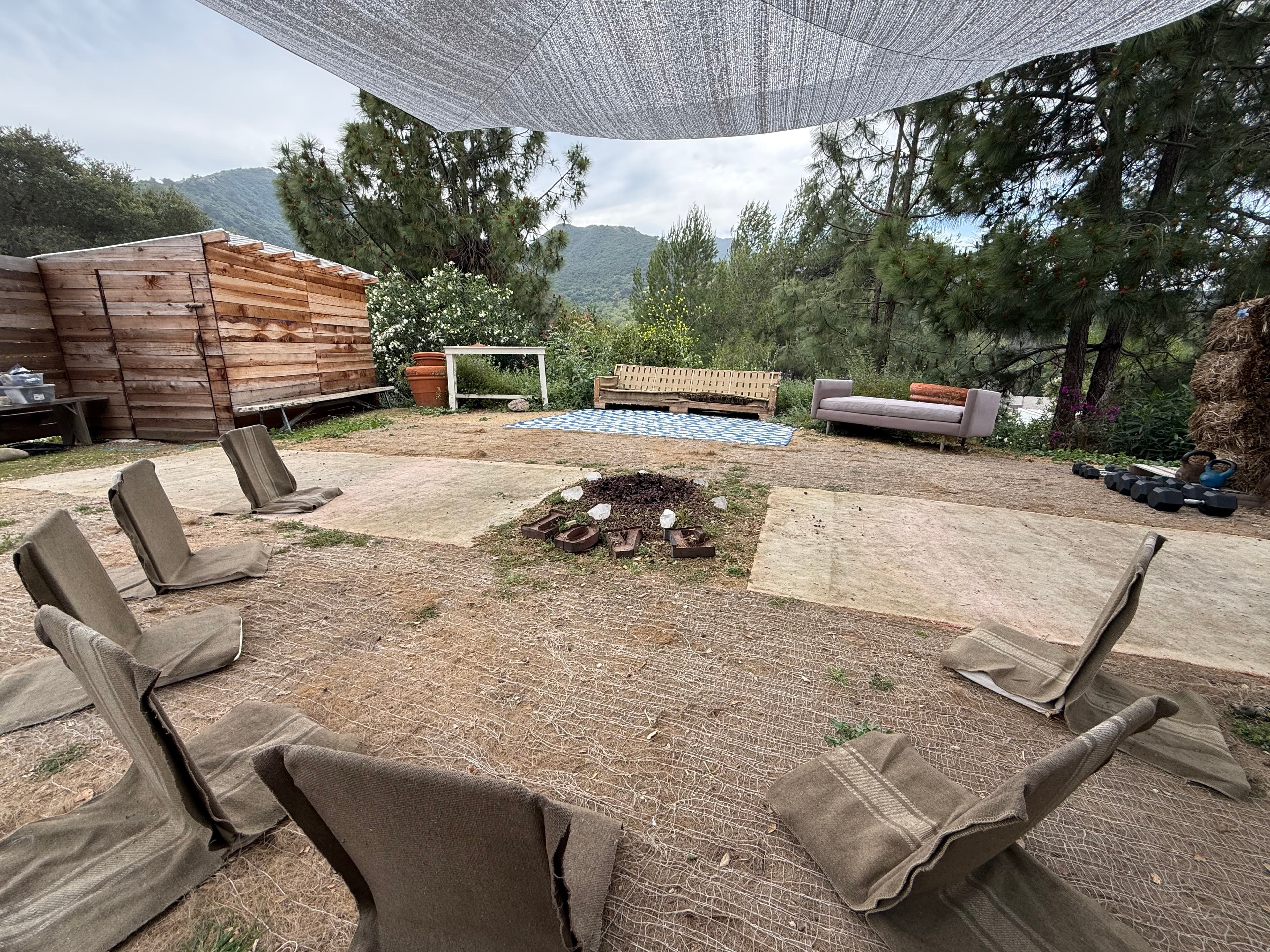 Outdoor circle with backjacks during the day.