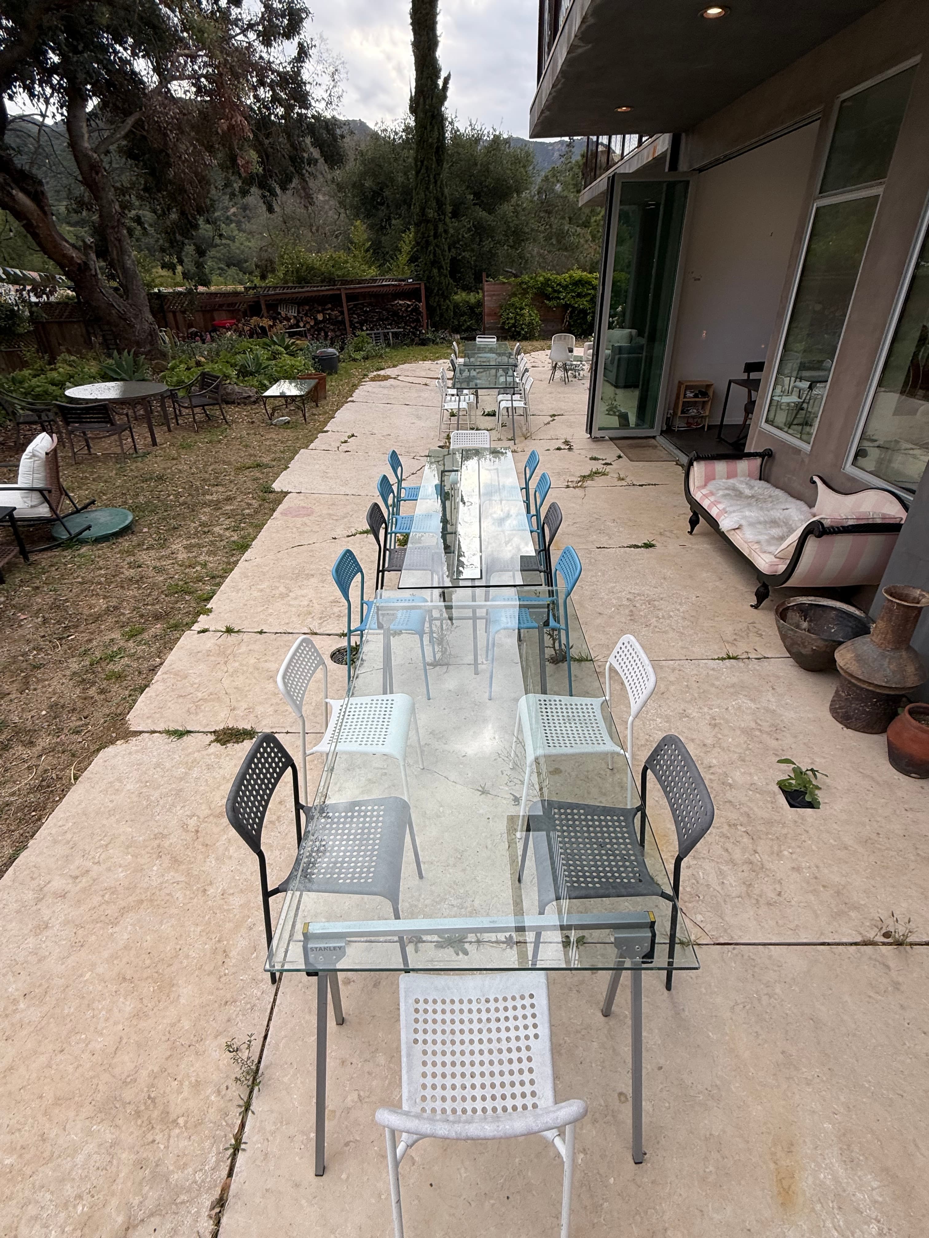 Long outdoor table during the day.