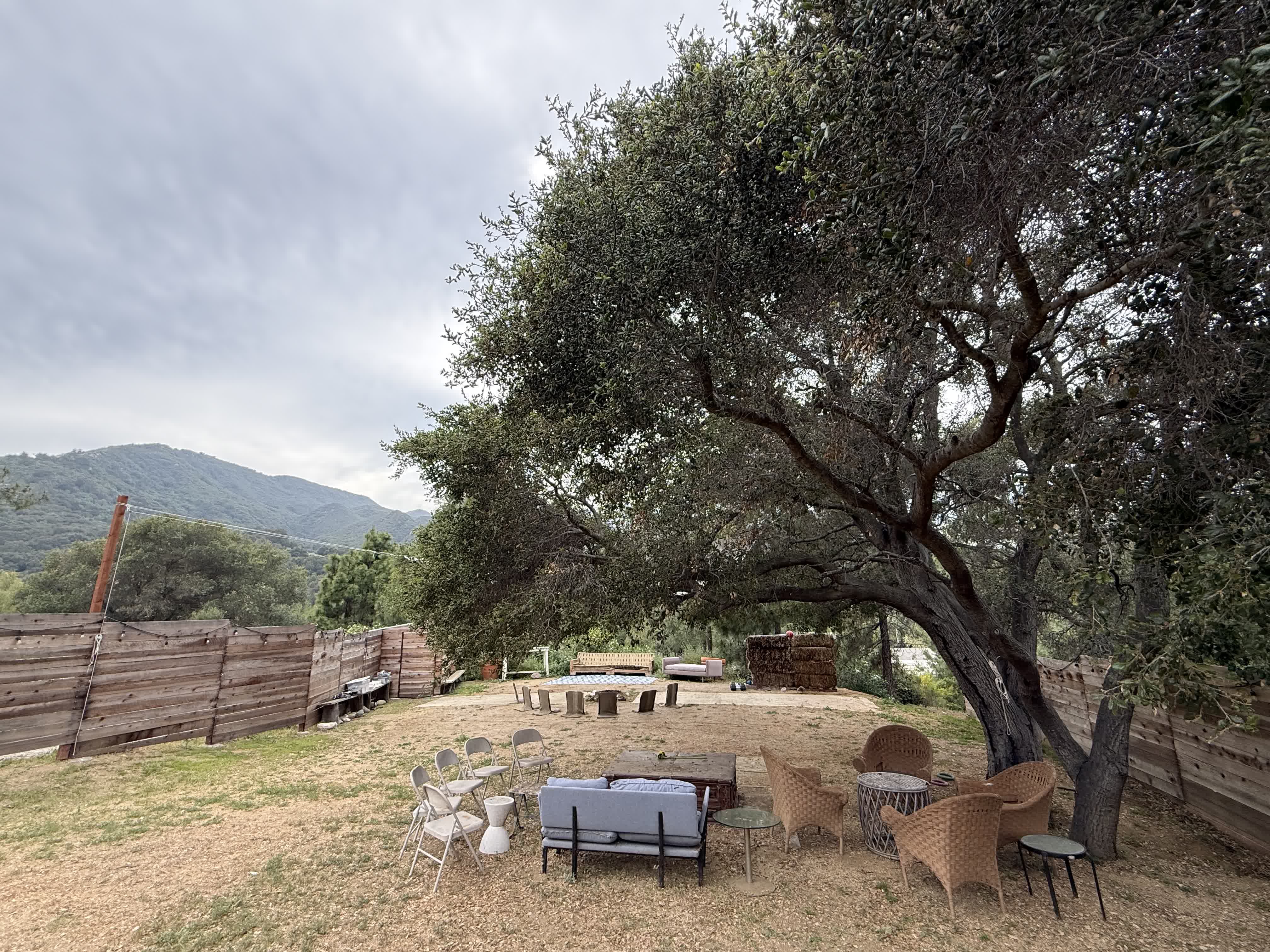 Outdoor gathering and work space at the Topanga house during the day.