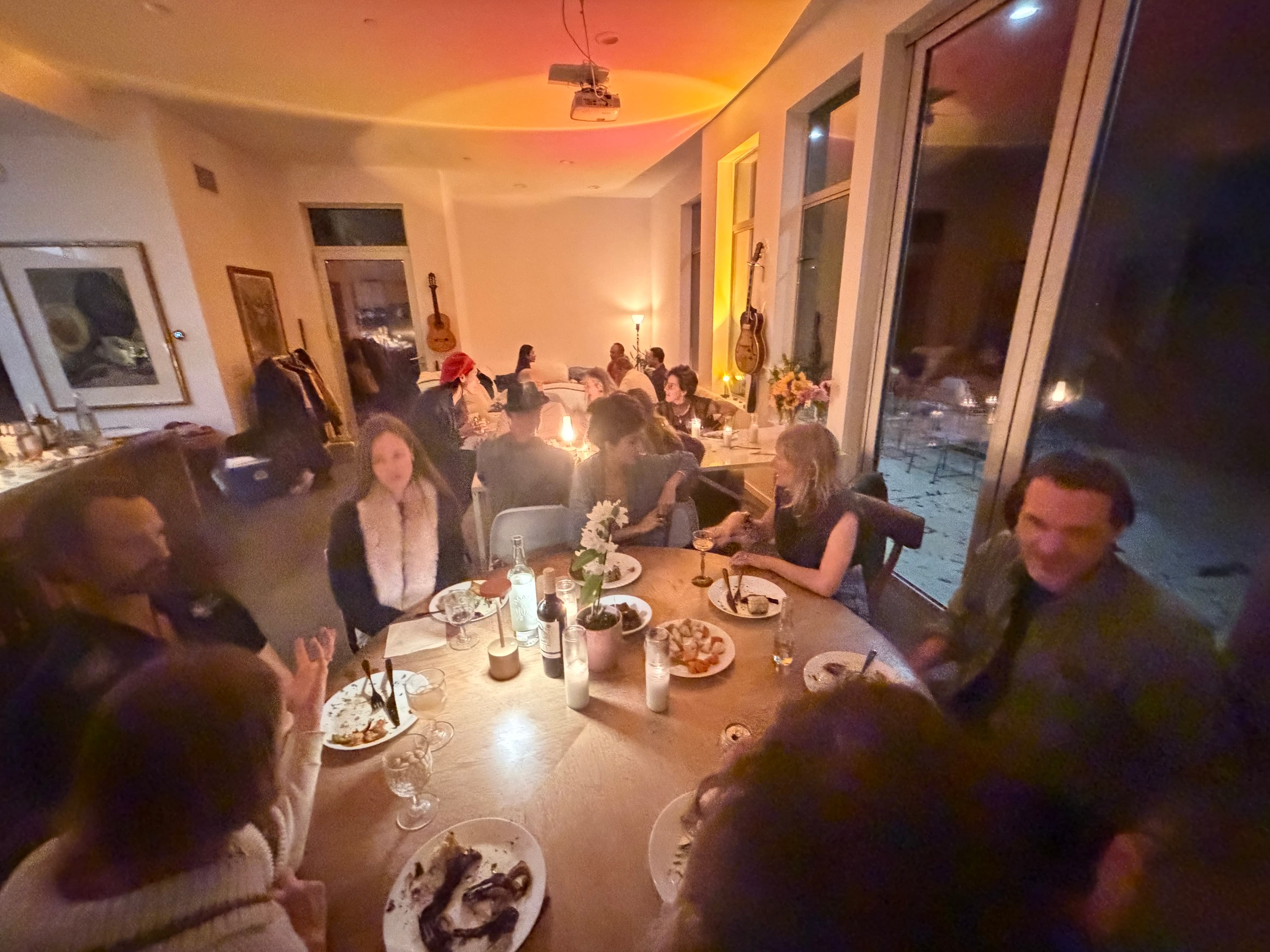 Community dinner gathering inside the Topanga house.